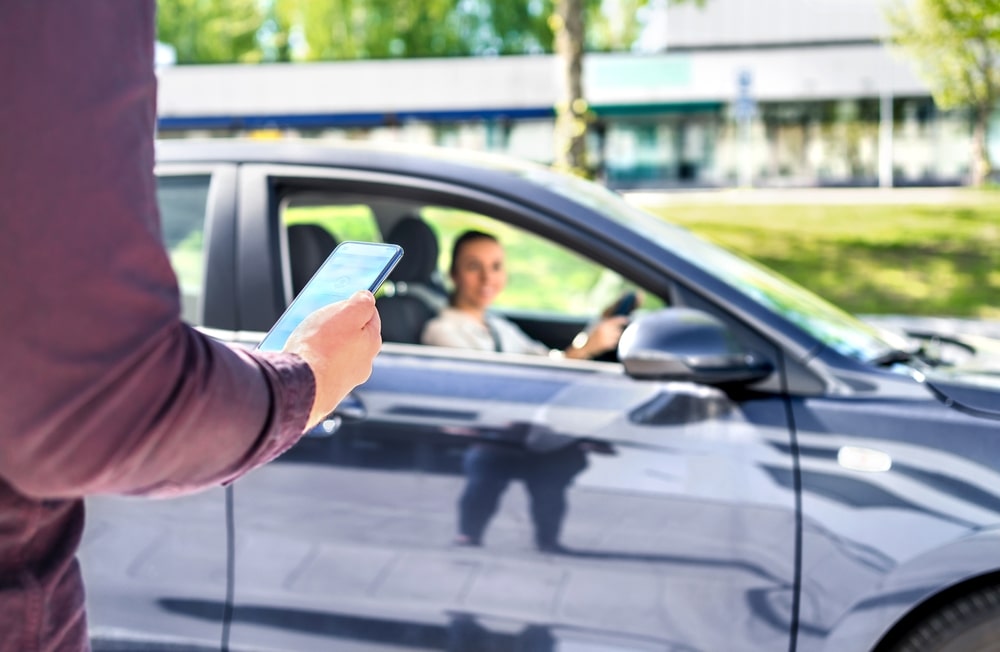 Rideshare Driver Picking Up A Passenger