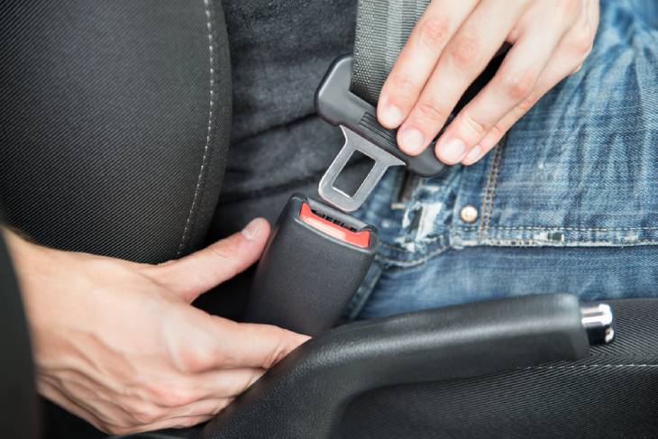 Photo of a man with seatbelt in the car