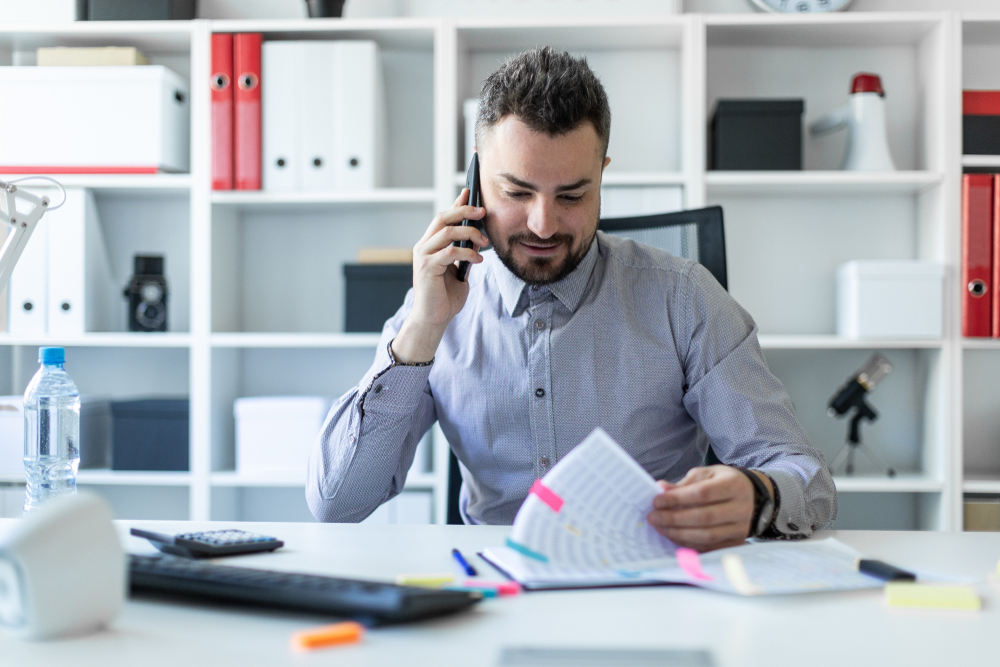 Photo of a Man Reviewing Documents